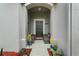 Welcoming front porch area with seating, flowers and tasteful decor at 2559 Eagle Bay Blvd, Kissimmee, FL 34743