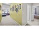 Hallway featuring neutral carpet that leads into the living and bedroom areas at 2559 Eagle Bay Blvd, Kissimmee, FL 34743