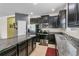 Well-equipped kitchen with granite countertops, stainless steel appliances and dark cabinetry at 2559 Eagle Bay Blvd, Kissimmee, FL 34743