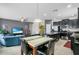 Open-concept living room with a view of the kitchen and blue sectional at 2559 Eagle Bay Blvd, Kissimmee, FL 34743