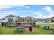 A neighborhood playground provides recreation near comfortable Gathering homes on a sunny day at 2559 Eagle Bay Blvd, Kissimmee, FL 34743