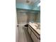 Bathroom features neutral walls, vanity with storage, and shower with curtain at 2900 S Semoran Blvd # S, Orlando, FL 32822