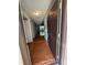 Hallway features beautiful tile flooring and a view of the bright, airy living spaces at 2900 S Semoran Blvd # S, Orlando, FL 32822