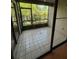 Screened patio offers ample sunlight and views of green landscape, providing a serene retreat at 2900 S Semoran Blvd # S, Orlando, FL 32822