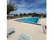 Enjoy the community pool with lounge chairs on the deck and a view of the community's amenities at 2900 S Semoran Blvd # S, Orlando, FL 32822