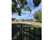 View of the tennis courts with lush green landscaping and blue skies at 2900 S Semoran Blvd # S, Orlando, FL 32822