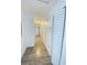 Bright hallway with wood-look flooring, fresh paint, and white doors at 305 S Palm Ave, Kissimmee, FL 34741