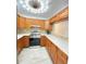 Well-lit kitchen features a modern range, ample countertop space, and rich wood cabinetry at 305 S Palm Ave, Kissimmee, FL 34741