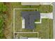 Aerial view of the house featuring a new roof, fenced yard, and patio at 33 Perch Dr, Kissimmee, FL 34759