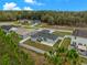 Aerial view of home featuring a large backyard with privacy fence and mature landscaping at 33 Perch Dr, Kissimmee, FL 34759