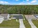 Aerial view of house featuring fenced in backyard and mature landscaping in quiet neighborhood at 33 Perch Dr, Kissimmee, FL 34759