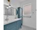 Stylish bathroom with a double vanity, pendant lighting, and a mirrored cabinet at 33 Perch Dr, Kissimmee, FL 34759
