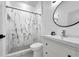 Modern bathroom with a tiled shower, vanity, and black accents at 33 Perch Dr, Kissimmee, FL 34759