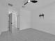 Modern room featuring tile flooring, natural light, and a wall-mounted TV bracket ready for customization at 33 Perch Dr, Kissimmee, FL 34759