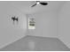 Cozy bedroom features neutral tile flooring and a window allowing for natural light at 33 Perch Dr, Kissimmee, FL 34759