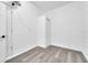 Spacious closet with vinyl plank flooring and a door for ample storage at 33 Perch Dr, Kissimmee, FL 34759