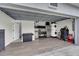 Spacious garage featuring laundry area, utility sink, and ample storage space at 33 Perch Dr, Kissimmee, FL 34759