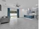 Bright and airy living space connecting to a kitchen, featuring tile flooring and ample natural light at 33 Perch Dr, Kissimmee, FL 34759