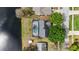 Aerial view of a private backyard pool with adjacent water feature at 3619 Willow Lake Ct, St Cloud, FL 34769
