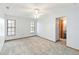 A light-filled bedroom with neutral carpet, white walls, and bright windows to create a calm and inviting space at 3619 Willow Lake Ct, St Cloud, FL 34769