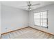 Bright bedroom featuring a ceiling fan, wall-to-wall carpeting, and a window for natural light at 3619 Willow Lake Ct, St Cloud, FL 34769