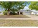 Charming single-story home featuring a two-car garage, mature tree, and well-maintained front yard at 3619 Willow Lake Ct, St Cloud, FL 34769