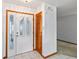 Bright foyer featuring tile flooring, white trim, and double-door entry with decorative glass panels at 3619 Willow Lake Ct, St Cloud, FL 34769