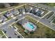 Community aerial view featuring a pool, sidewalks, crosswalks, and manicured lawns at 3987 Meandering Bay Dr, Apopka, FL 32712