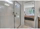 Shower room with clear glass and a partial view into the main bedroom at 3987 Meandering Bay Dr, Apopka, FL 32712