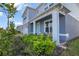 Charming two-story home boasts a brick-paved driveway, attached garage, and beautifully landscaped front yard at 3987 Meandering Bay Dr, Apopka, FL 32712