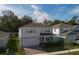 Charming two-story home with well-maintained lawn, front porch and a two-car garage at 3987 Meandering Bay Dr, Apopka, FL 32712