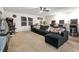 Game room featuring a large sectional sofa, arcade games, and entertainment options at 3987 Meandering Bay Dr, Apopka, FL 32712