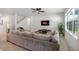 Comfortable living room with plush sectional sofa, large windows, and a modern entertainment center at 3987 Meandering Bay Dr, Apopka, FL 32712