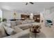 Spacious living room featuring a comfortable sectional sofa and open kitchen views at 3987 Meandering Bay Dr, Apopka, FL 32712