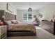 Bright main bedroom with carpet, natural light and stylish decor at 3987 Meandering Bay Dr, Apopka, FL 32712