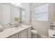 Chic bathroom features a marble countertop, modern fixtures, and great natural light at 4311 Via Cavour Ct, Kissimmee, FL 34759