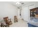 Cozy bedroom showcases light walls and tiled floors, offering a serene space at 4311 Via Cavour Ct, Kissimmee, FL 34759
