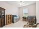 Comfortable bedroom features a sunny window and tiled floors, bathed in natural light at 4311 Via Cavour Ct, Kissimmee, FL 34759