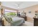 Bedroom featuring a large window overlooking a scenic lake view at 4311 Via Cavour Ct, Kissimmee, FL 34759