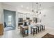 Modern kitchen featuring stainless steel appliances, white cabinetry, and an island with seating at 4311 Via Cavour Ct, Kissimmee, FL 34759