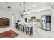 Modern kitchen featuring stainless steel appliances, white cabinetry, and an island with seating at 4311 Via Cavour Ct, Kissimmee, FL 34759