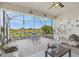 Screened-in lanai featuring a seating area and views of the lake at 4311 Via Cavour Ct, Kissimmee, FL 34759