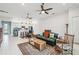An open concept living space with hardwood floors connects the kitchen and living area at 4311 Via Cavour Ct, Kissimmee, FL 34759