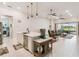 Spacious living room with a large island open to the kitchen and sliding glass doors at 4311 Via Cavour Ct, Kissimmee, FL 34759