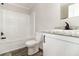 Clean bathroom with tub, tile flooring, and modern vanity with granite counter at 4626 Bunting Ave, Orlando, FL 32812