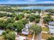 Scenic aerial shot of the property with a tranquil lake backdrop, highlighting its desirable location at 528 S 8Th St, Lake Wales, FL 33853