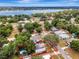 Stunning aerial view of the property, showcasing its proximity to a beautiful lake and lush surroundings at 528 S 8Th St, Lake Wales, FL 33853