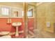 Well-lit bathroom featuring terracotta tile, a modern shower, and pedestal sink that blends vintage style at 528 S 8Th St, Lake Wales, FL 33853