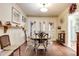 Formal dining room with a large table, decorative chairs, and an adjoining pantry and kitchen at 528 S 8Th St, Lake Wales, FL 33853