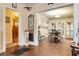 Open-concept dining room with hardwood floors, chandelier, and adjacent bathroom offers vintage elegance at 528 S 8Th St, Lake Wales, FL 33853
